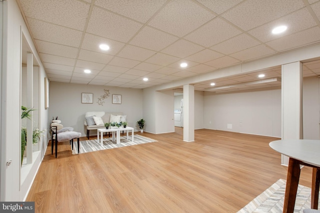 sitting room featuring recessed lighting, a drop ceiling, and light wood-type flooring