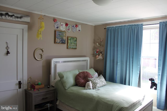 bedroom featuring crown molding