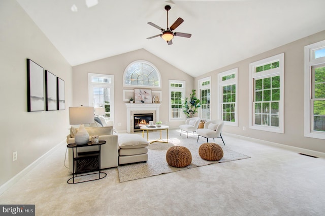 7820 Elsinore Dr, Manassas, VA 20112 - living area featuring ceiling fan, a glass covered fireplace, baseboards, and carpet