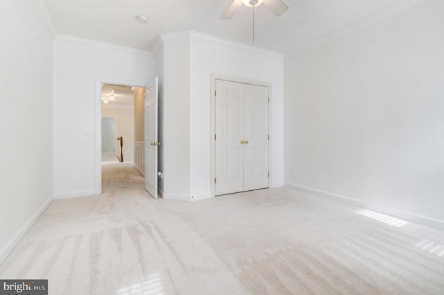 7820 Elsinore Dr, Manassas, VA 20112 - unfurnished bedroom featuring a ceiling fan, crown molding, baseboards, a closet, and carpet