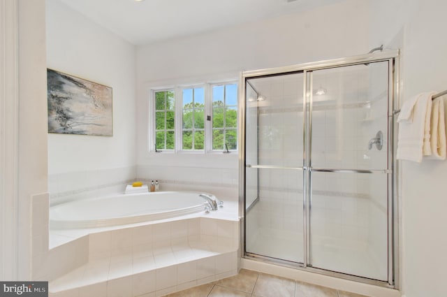 7820 Elsinore Dr, Manassas, VA 20112 - bathroom with tile patterned floors, a bath, and a stall shower