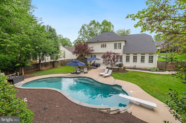 7820 Elsinore Dr, Manassas, VA 20112 - view of pool featuring a lawn, a patio, a fenced in pool, and a fenced backyard