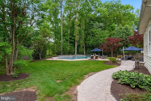 7820 Elsinore Dr, Manassas, VA 20112 - view of yard with fence, an outdoor hangout area, a patio area, and an outdoor pool