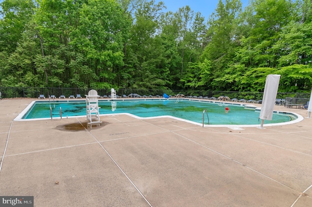 7820 Elsinore Dr, Manassas, VA 20112 - pool with a patio and fence