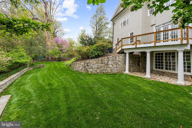 view of yard featuring a wooden deck
