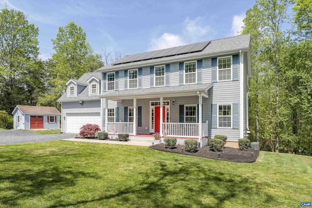 2445 Lindsay Rd, Gordonsville, VA 22942 - colonial house featuring a porch, a front lawn, driveway, and solar panels