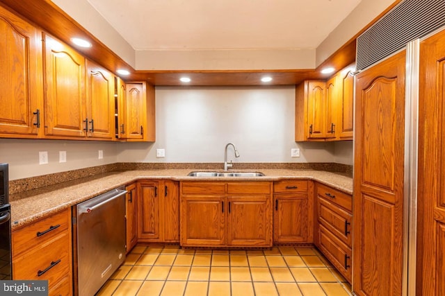 kitchen featuring a sink, brown cabinets, light tile patterned floors, dishwasher, and recessed lighting