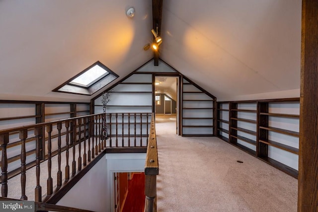 additional living space featuring carpet and vaulted ceiling with skylight