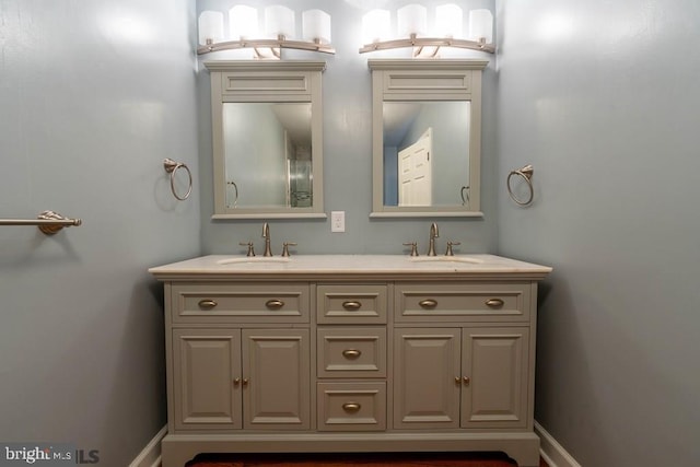 bathroom with double vanity and a sink