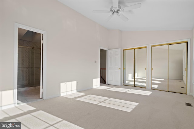 6915 Compton Valley Ct, Centreville, VA 20121 - unfurnished bedroom featuring vaulted ceiling, ensuite bathroom, two closets, carpet, and visible vents