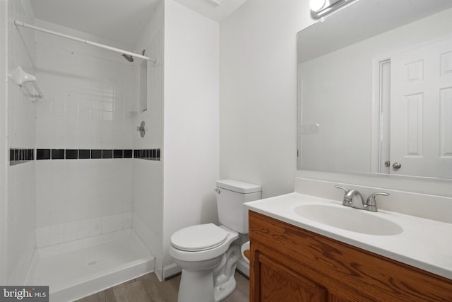 6915 Compton Valley Ct, Centreville, VA 20121 - full bath featuring a tile shower, wood finished floors, toilet, and vanity