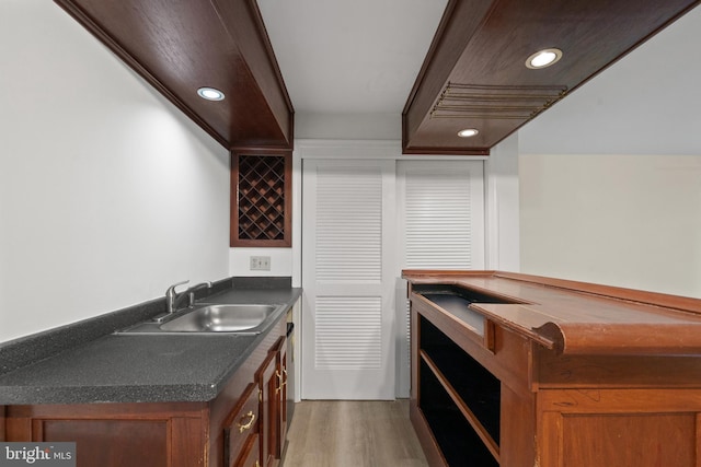6915 Compton Valley Ct, Centreville, VA 20121 - bar featuring recessed lighting, wet bar, a sink, and light wood-type flooring