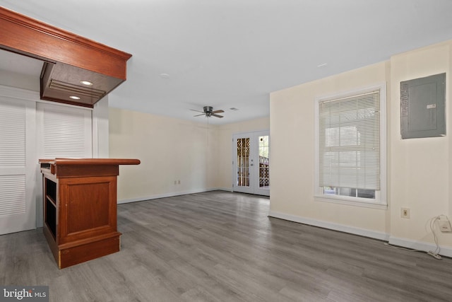 6915 Compton Valley Ct, Centreville, VA 20121 - unfurnished living room featuring ceiling fan, baseboards, wood finished floors, and electric panel
