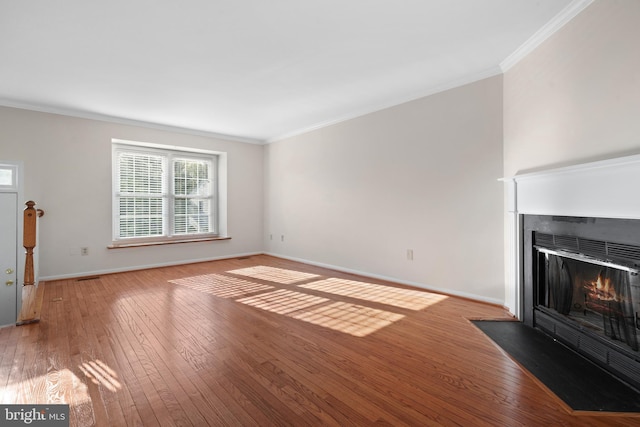 6915 Compton Valley Ct, Centreville, VA 20121 - unfurnished living room featuring a fireplace with flush hearth, light wood-style flooring, baseboards, and ornamental molding