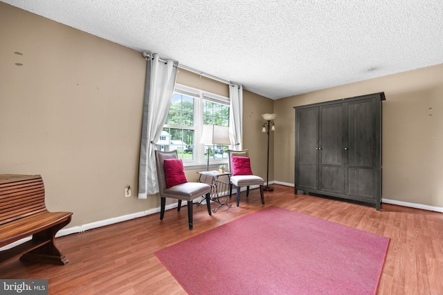 1713 Emerson Ave, Salisbury, MD 21801 - living area featuring wood finished floors, a textured ceiling, and baseboards