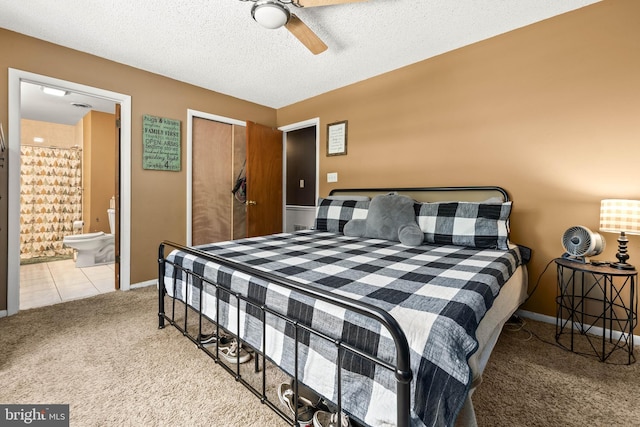 1713 Emerson Ave, Salisbury, MD 21801 - carpeted bedroom with a closet, baseboards, ensuite bath, ceiling fan, and a textured ceiling