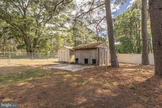 1713 Emerson Ave, Salisbury, MD 21801 - view of shed featuring a fenced backyard and view of wooded area