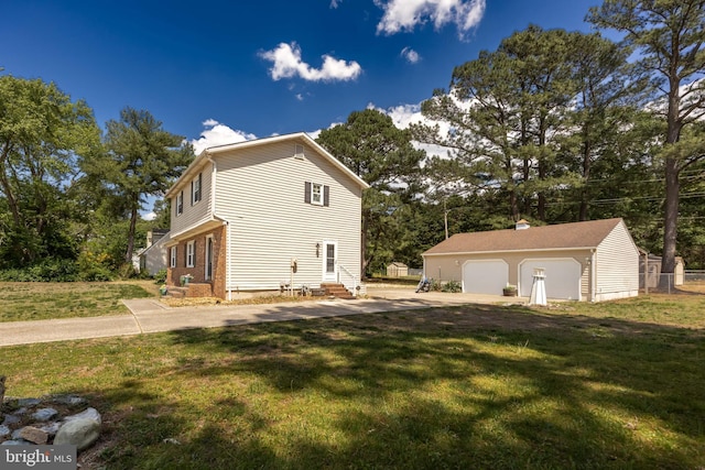 1713 Emerson Ave, Salisbury, MD 21801 - view of home's exterior with entry steps, an outbuilding, a detached garage, and a yard