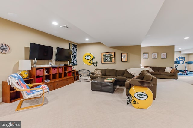 living area with recessed lighting, visible vents, and carpet