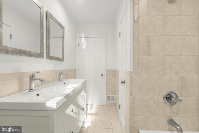 2124 Weber Dr, District Heights, MD 20747 - full bathroom featuring tile patterned flooring, a sink, double vanity, and tile walls