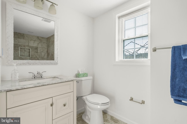 2124 Weber Dr, District Heights, MD 20747 - full bathroom featuring visible vents, toilet, vanity, baseboards, and a shower