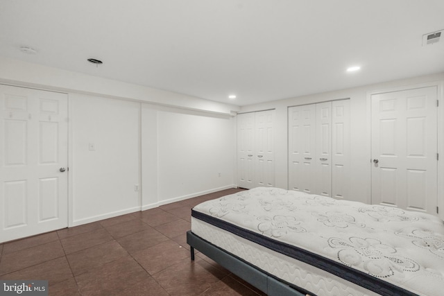 2124 Weber Dr, District Heights, MD 20747 - bedroom with recessed lighting, multiple closets, visible vents, baseboards, and dark tile patterned flooring