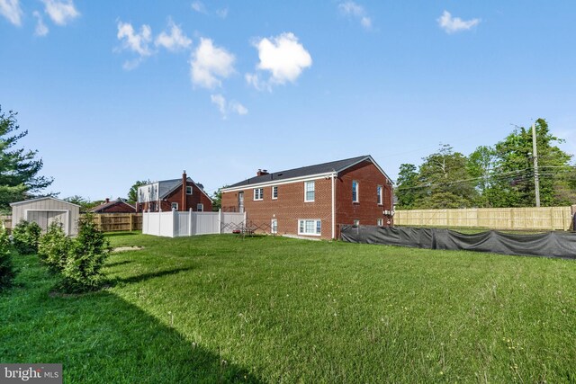 2124 Weber Dr, District Heights, MD 20747 - view of yard featuring a fenced backyard, an outdoor structure, and a storage shed