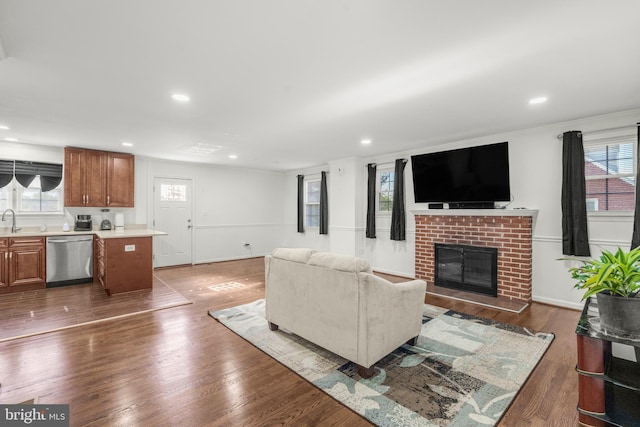2124 Weber Dr, District Heights, MD 20747 - living area with recessed lighting, a brick fireplace, a wealth of natural light, and dark wood-style flooring