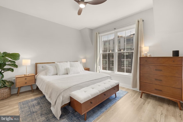 bedroom with a ceiling fan and light wood finished floors