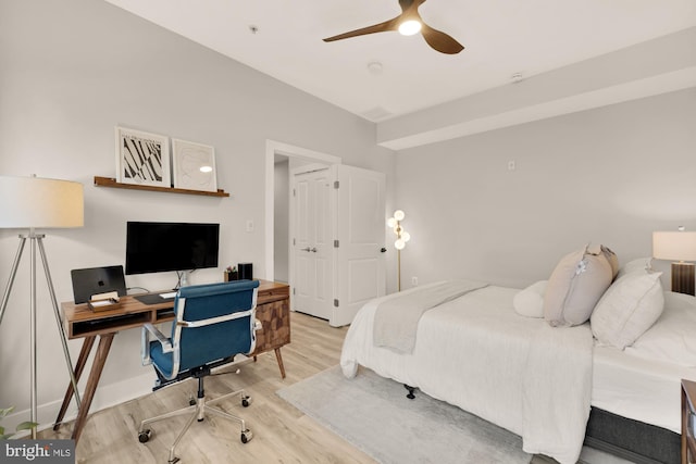 bedroom featuring a ceiling fan and wood finished floors