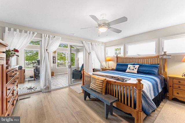 bedroom featuring light wood-style floors, ceiling fan, and access to exterior