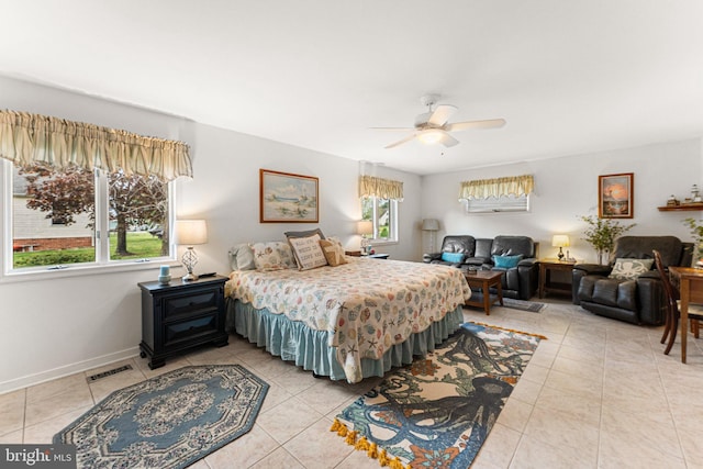 bedroom with light tile patterned floors, baseboards, ceiling fan, and visible vents