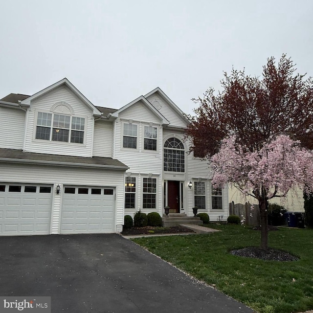103 Claude Ct SE, Leesburg, VA 20175 - traditional-style house featuring aphalt driveway, a front yard, and a garage