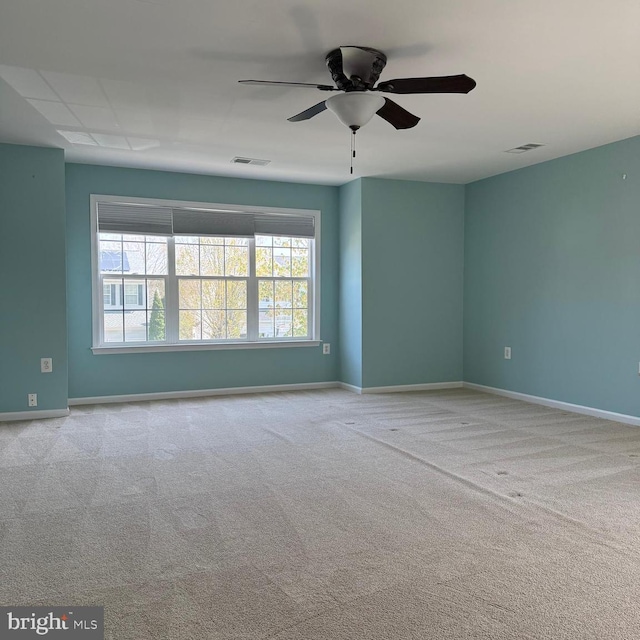 103 Claude Ct SE, Leesburg, VA 20175 - unfurnished room with visible vents, carpet flooring, baseboards, and a ceiling fan
