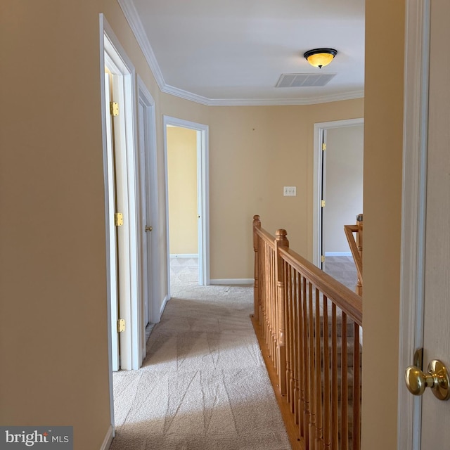 103 Claude Ct SE, Leesburg, VA 20175 - hallway featuring visible vents, ornamental molding, an upstairs landing, baseboards, and carpet flooring