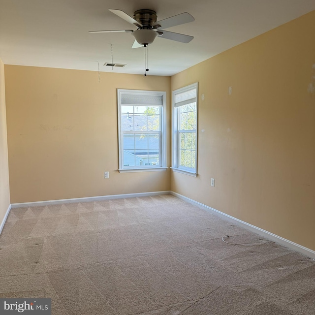 103 Claude Ct SE, Leesburg, VA 20175 - spare room featuring baseboards, visible vents, light colored carpet, and ceiling fan