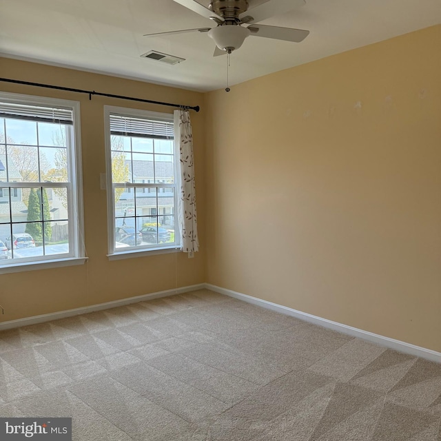 103 Claude Ct SE, Leesburg, VA 20175 - empty room featuring ceiling fan, baseboards, a wealth of natural light, and light colored carpet