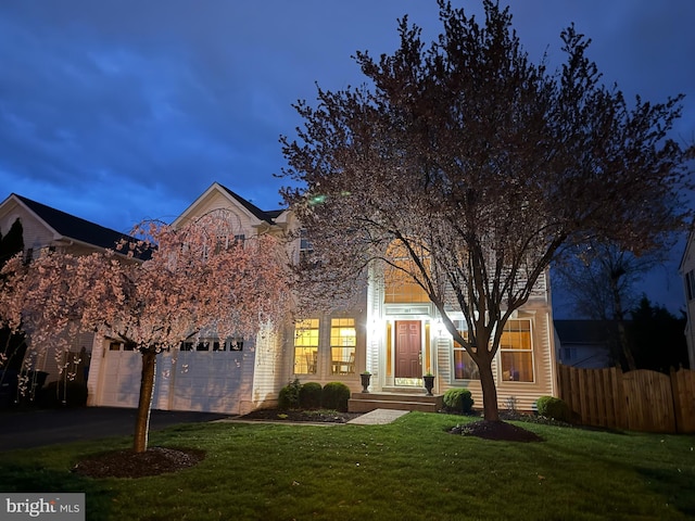 103 Claude Ct SE, Leesburg, VA 20175 - view of front facade with fence, an attached garage, driveway, and a front yard
