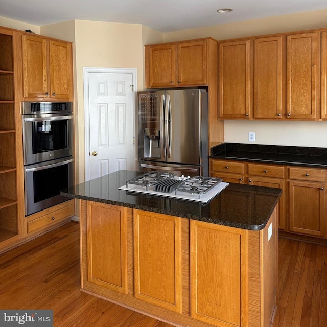 103 Claude Ct SE, Leesburg, VA 20175 - kitchen with open shelves, wood finished floors, brown cabinetry, and stainless steel appliances