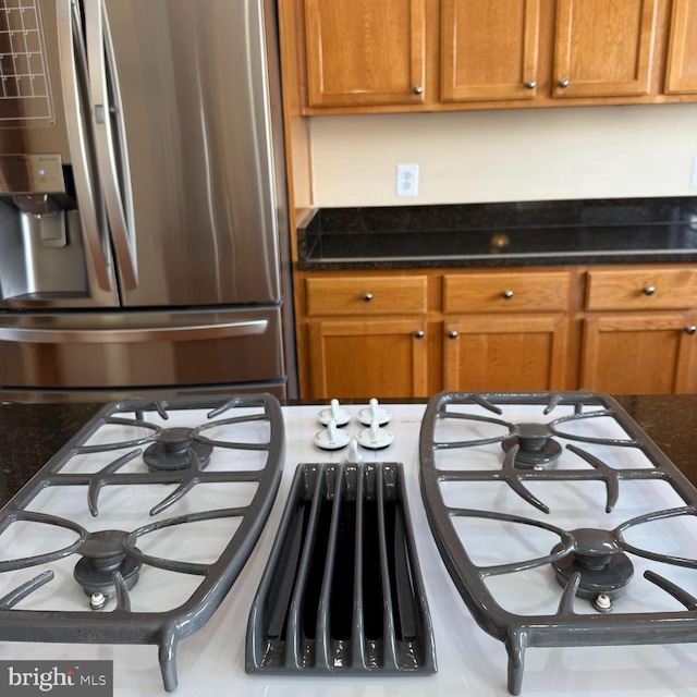 103 Claude Ct SE, Leesburg, VA 20175 - kitchen with brown cabinetry and stainless steel fridge