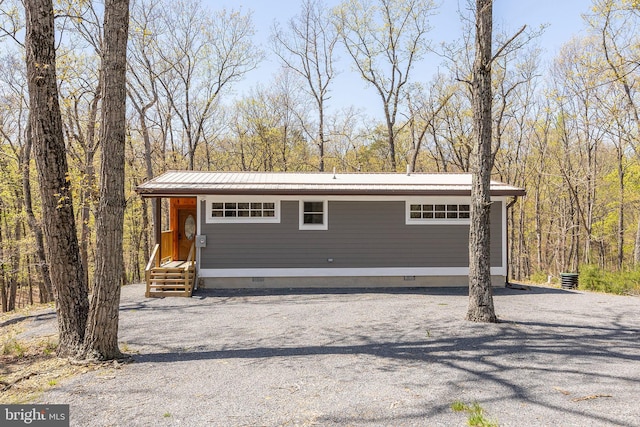 275 Oak Forest Ln, Berkeley Springs, WV 25411 - garage featuring a wooded view