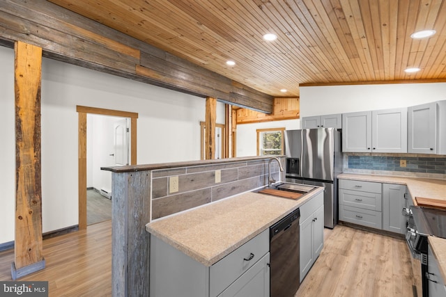 275 Oak Forest Ln, Berkeley Springs, WV 25411 - kitchen with stainless steel fridge, backsplash, gray cabinetry, black dishwasher, and recessed lighting