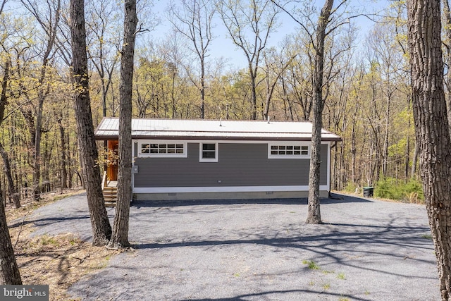 275 Oak Forest Ln, Berkeley Springs, WV 25411 - garage featuring a view of trees