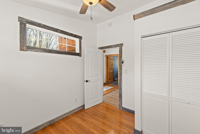 275 Oak Forest Ln, Berkeley Springs, WV 25411 - unfurnished bedroom featuring baseboards, a closet, and light wood-type flooring