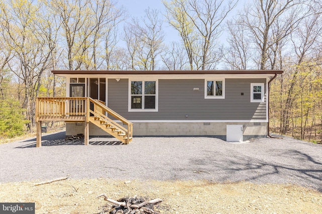 275 Oak Forest Ln, Berkeley Springs, WV 25411 - back of property with crawl space, a wooden deck, a sunroom, and stairs