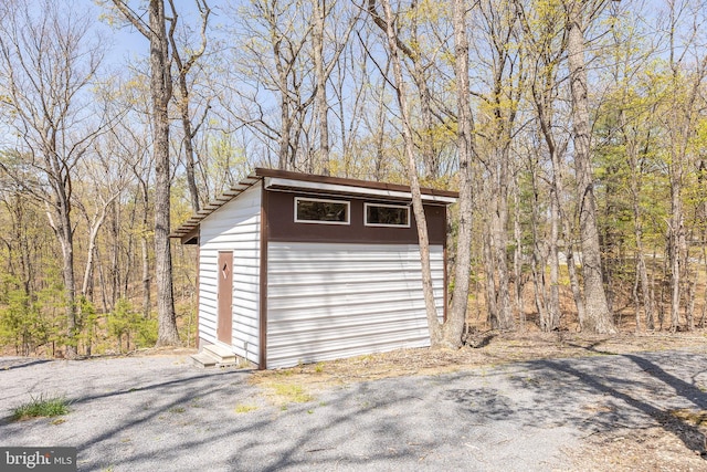 275 Oak Forest Ln, Berkeley Springs, WV 25411 - garage featuring a storage unit