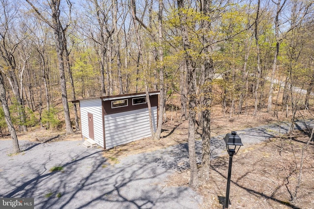 275 Oak Forest Ln, Berkeley Springs, WV 25411 - view of shed featuring a forest view