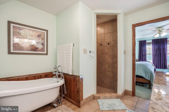 full bath featuring tile patterned floors, a freestanding bath, ensuite bath, and a tile shower