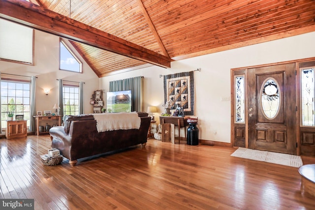living room with beamed ceiling, baseboards, high vaulted ceiling, wood ceiling, and hardwood / wood-style flooring