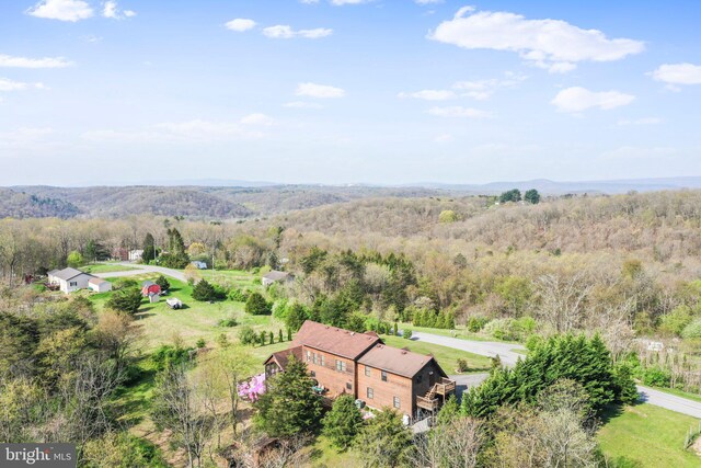 aerial view featuring a forest view